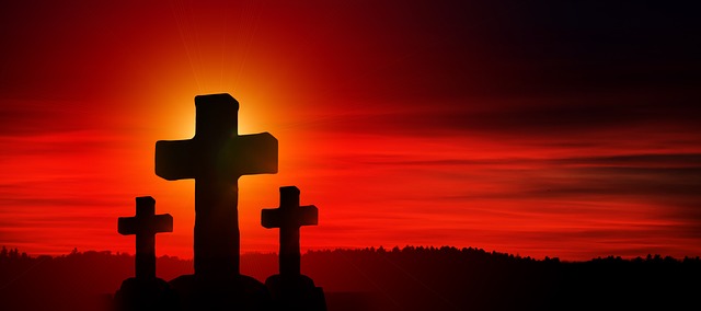 Image of three crosses at sunset.