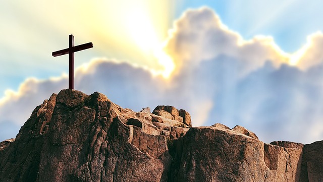 Image of a cross on a mountaintop