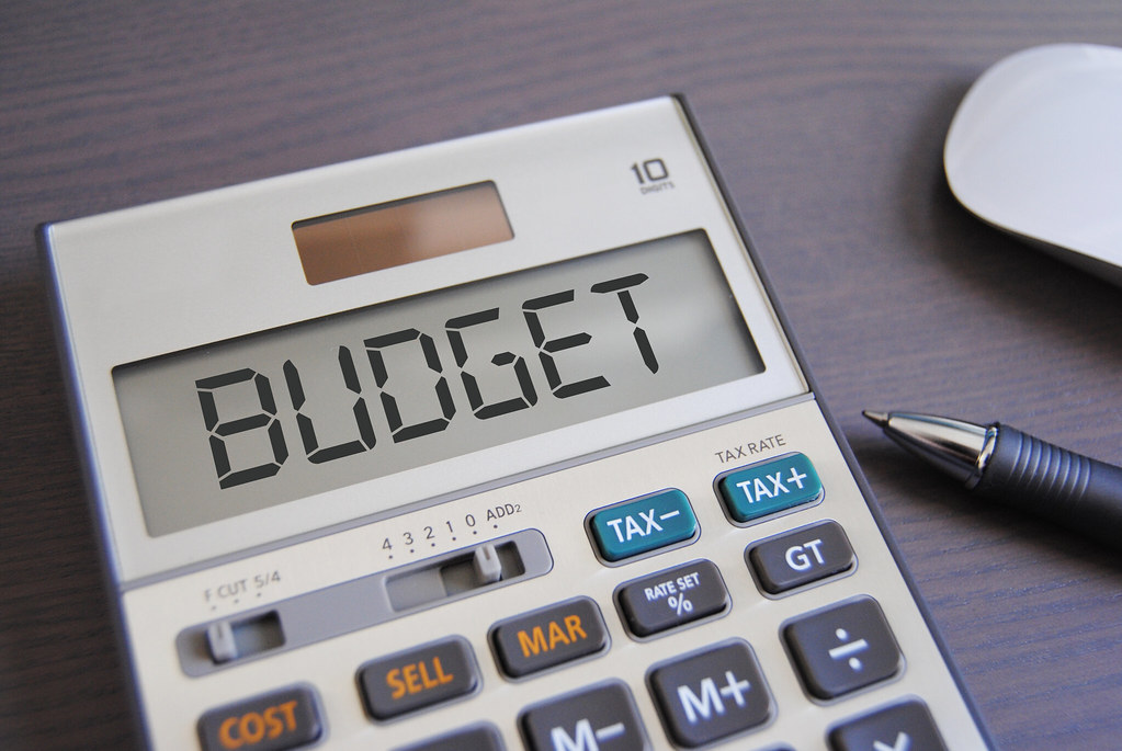 A calculator with the word "budget" written in the screen