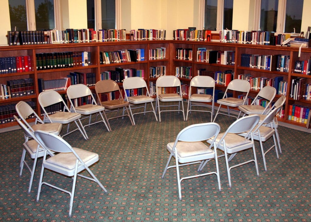 A photo of folding chairs placed in a circle