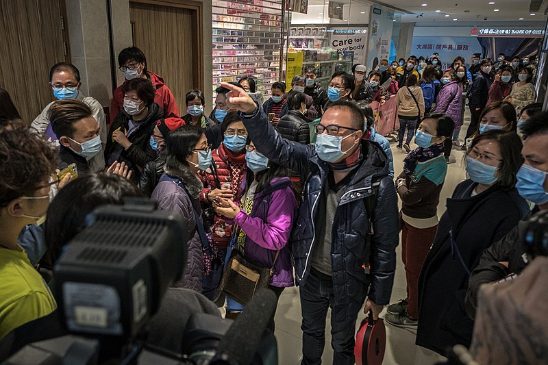 People waiting in line for masks