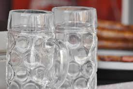 Two empty glass beer mugs