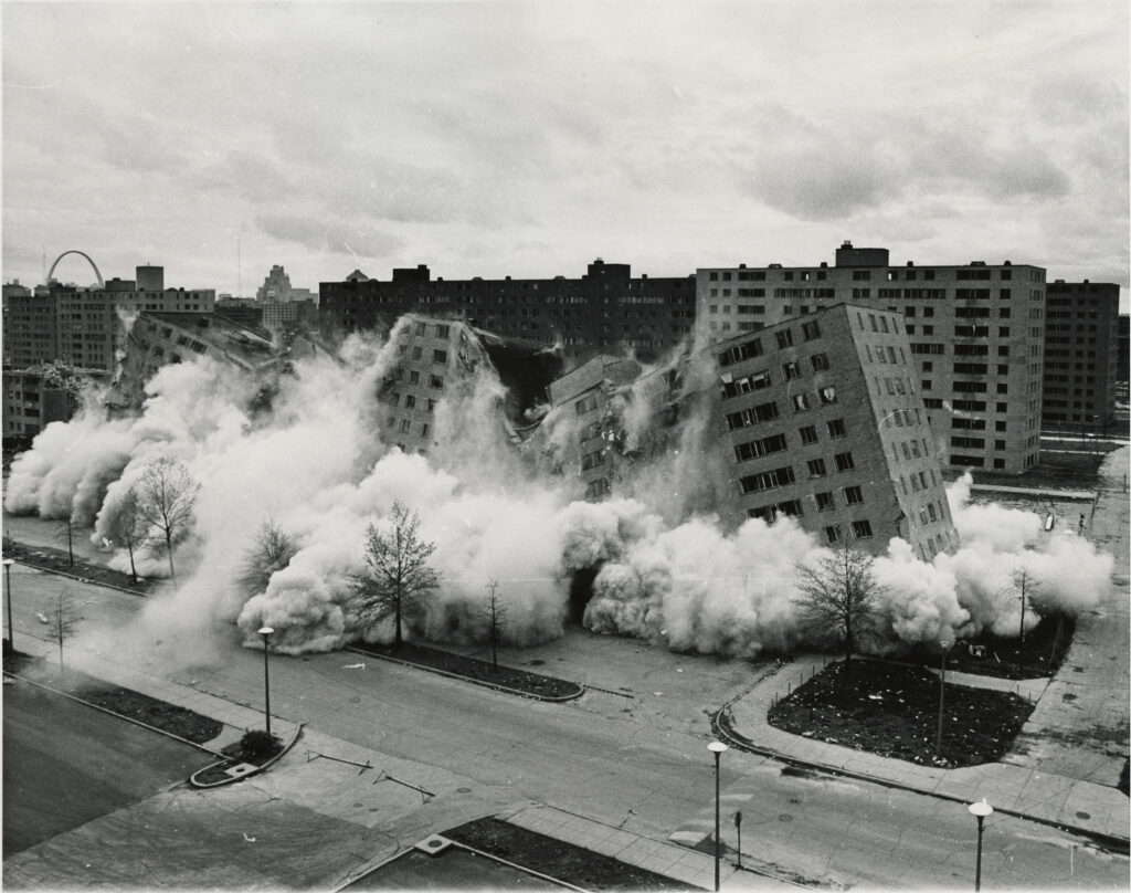 Photo of the demolition of the Pruitt-Igoe public housing project.