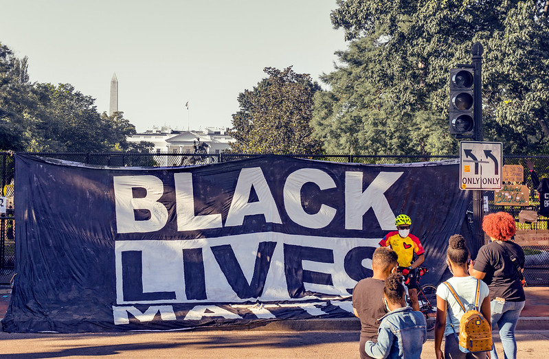 A Blue banner reads "Black Lives Matter."