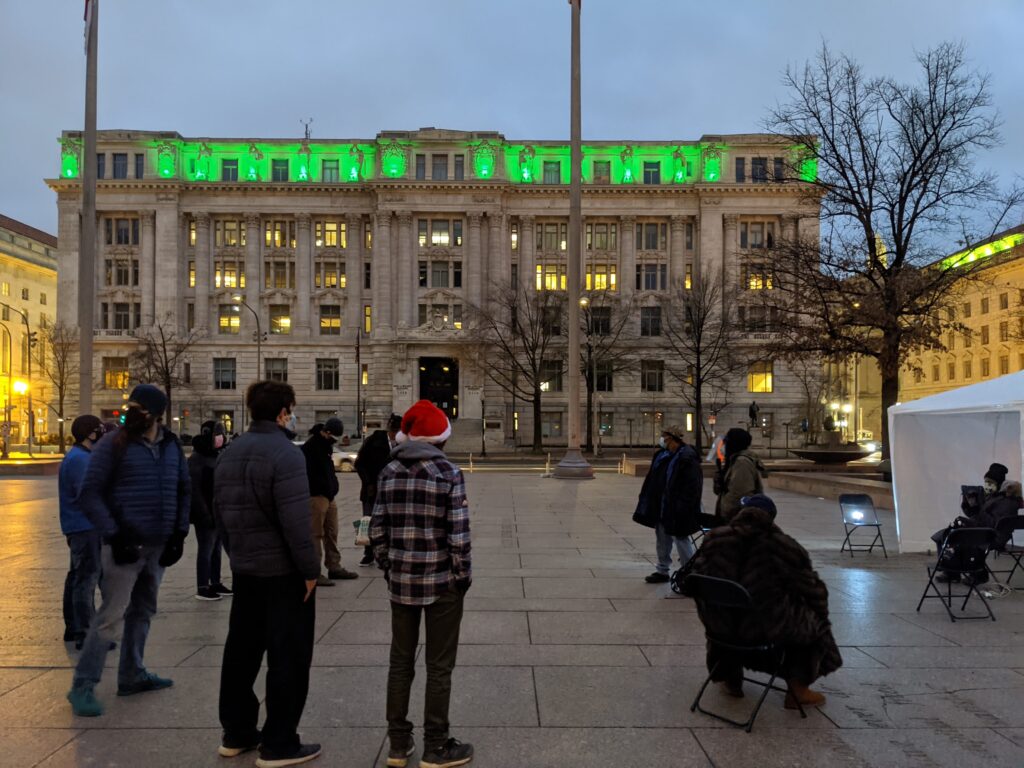 Photo of people gathered in front of the Wilson Building