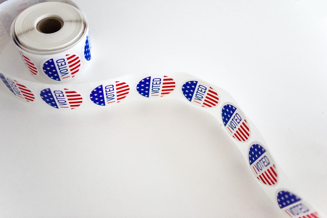 A roll of stickers that say 'I voted'