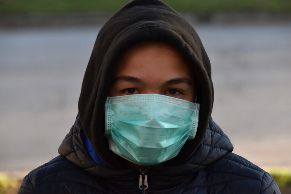 photo of boy with mask