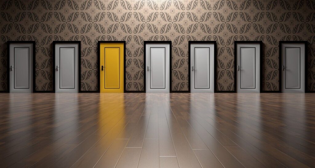 Image of 7 doors, 6 white, and 1 bright yellow in color.