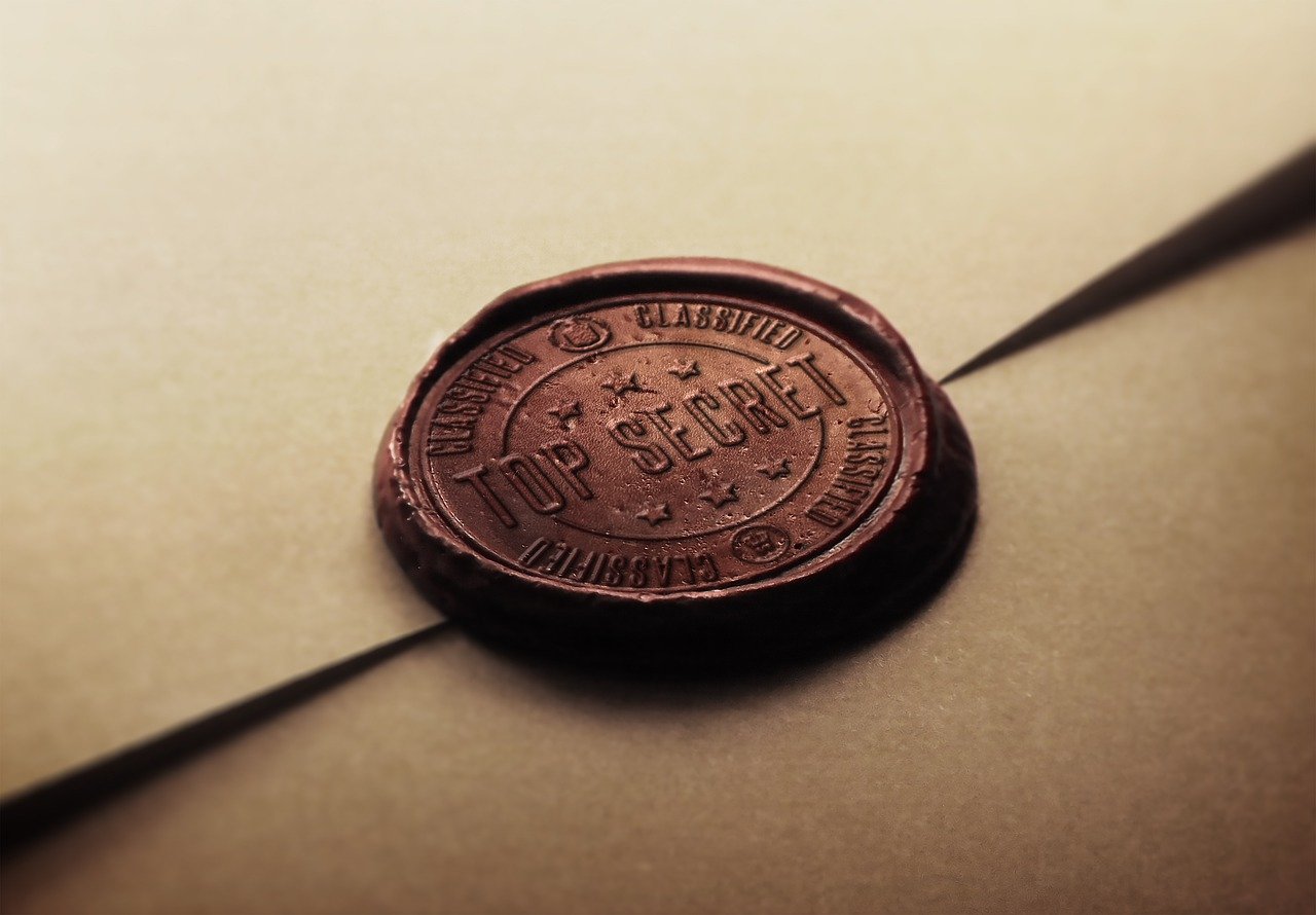 An image of a wax seal with the words "TOP SECRET" spelled out across the wax.