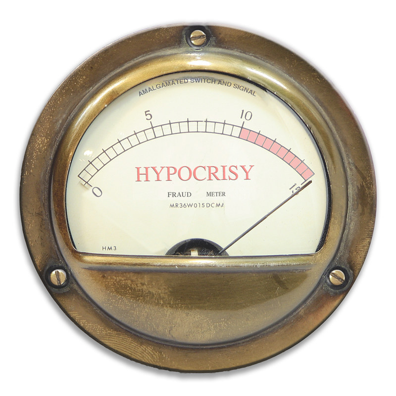Photo of a somewhat rusted hypocrisy meter with the needle pointed in the red zone.