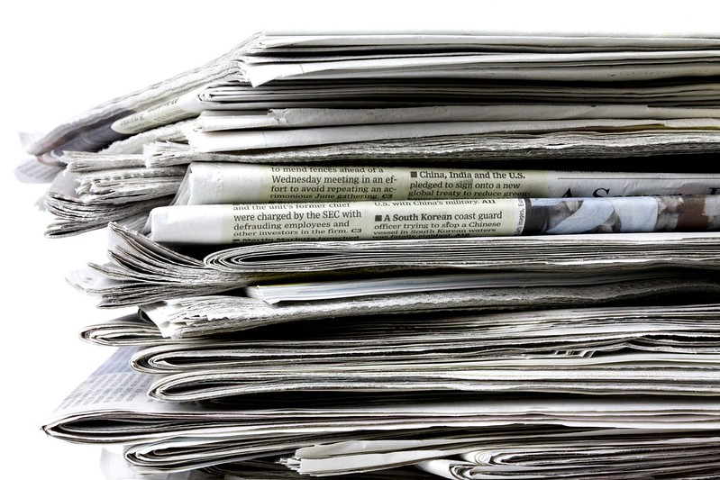 Photo of a stack of news papers.