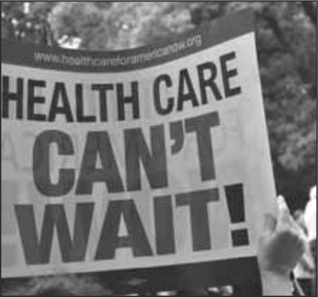An image of a sign saying "Health Care Can't Wait!"