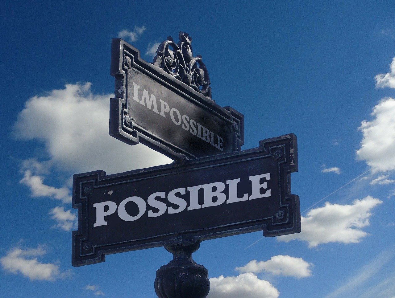 An image of a street sign with "possible" and "impossible" being the intersection.