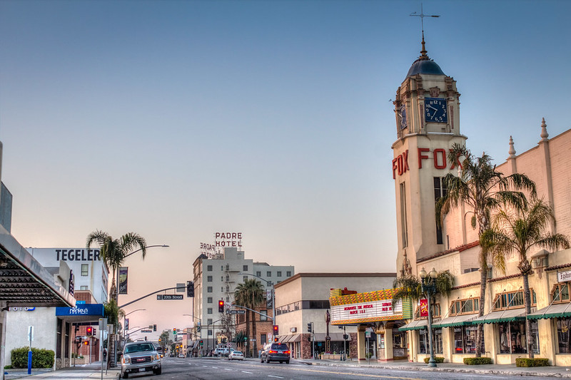 A view of H Street in Bakersfield, California including three landmarks; The Tegeler Hotel, the Fox Theater and the Padre Hotel.