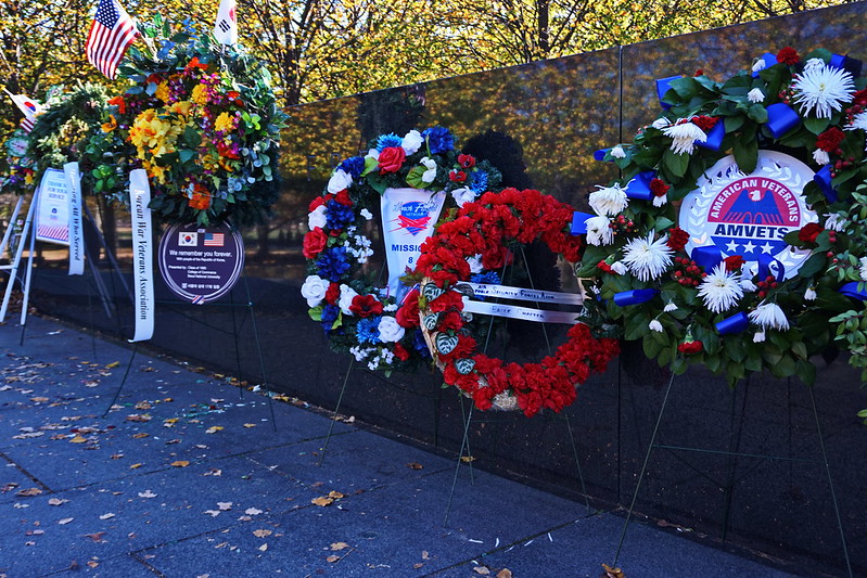 Images of memorial wreathes placed at the Vietnam War Memorial in Washington, DC