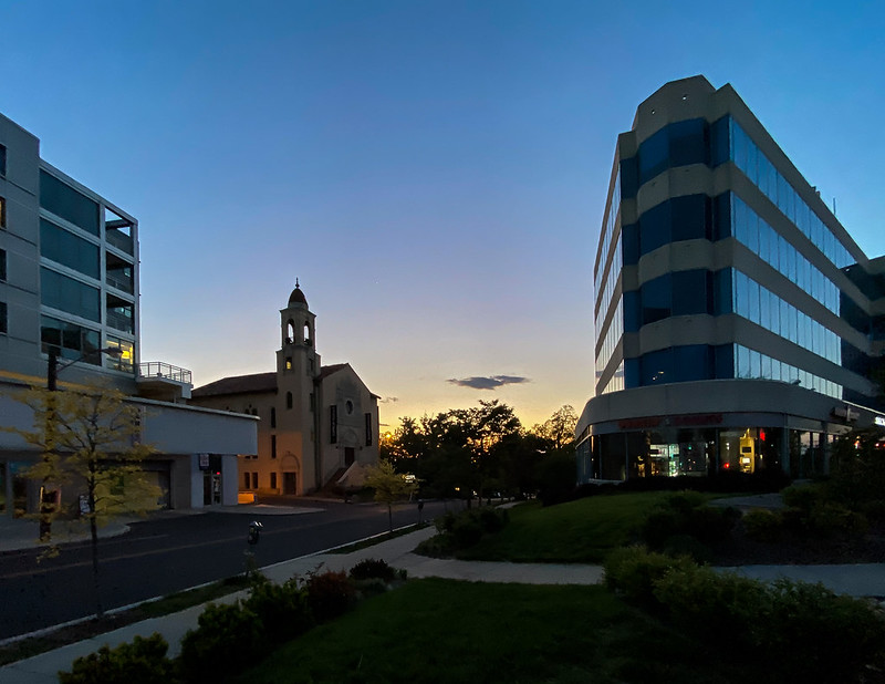 Photo of a church and commercial buildings at sunset in Tenleytown, an area in NW Washington, DC.