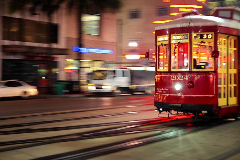 Photo of a New Orleans Trolley moving by.