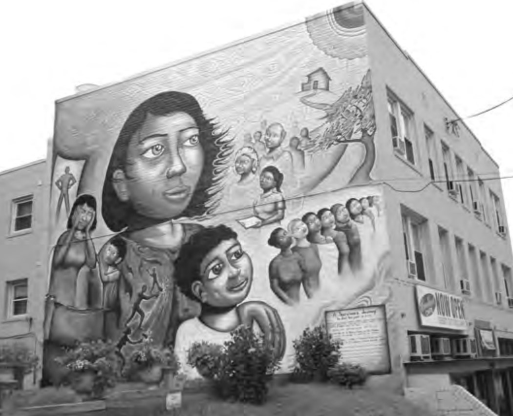Photo of a mural depicting the story of a mother's struggle to leave behind a life of domestic violence.