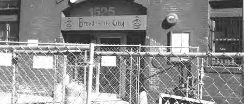 Photo of the front of Bread for the City's Northwest Center. Fence surrounds the perimeter due to construction.