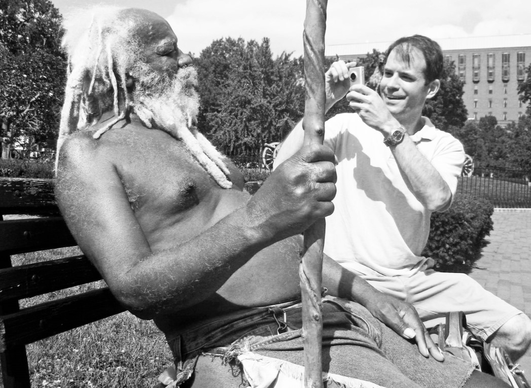 Photo of Sandridge sitting with "Nature Boy" on a park bench.