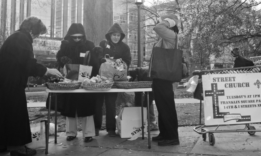 Street Church members serve food to participants.