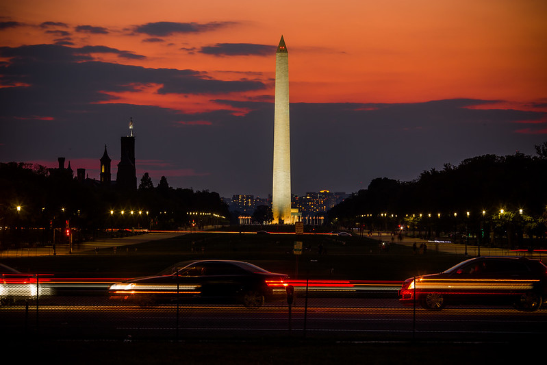Photo of the National Mall in DC at dusk; the Washington Monument is centered