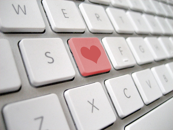 Photo of a laptop keyboard with a heart key in place of the letter D