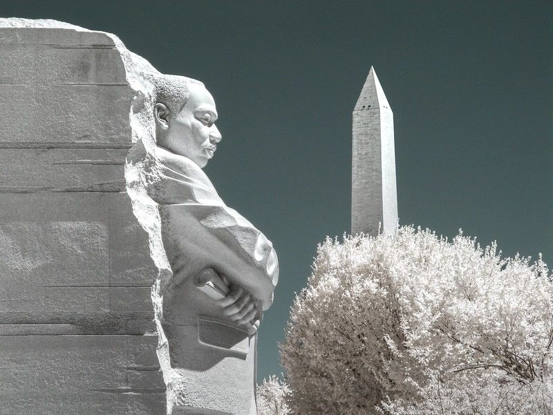 A view of the Martin Luther King Jr Memorial with the Washington Monument in the background