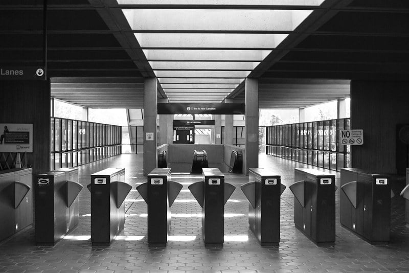 Black and white photo of fare gates at a Metro Station