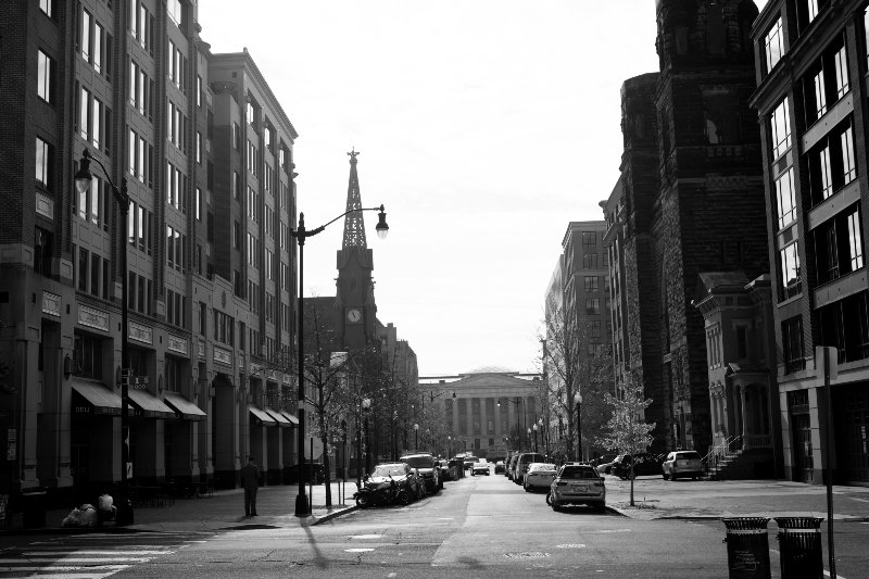 A black and white photo of 8th and I streets NW. The street was empty due to the quarantine at the time. The National Portrait Gallery and Smithsonian American Art museum is visible in the distance.