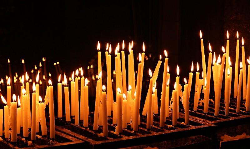 Photo of numerous lit candles