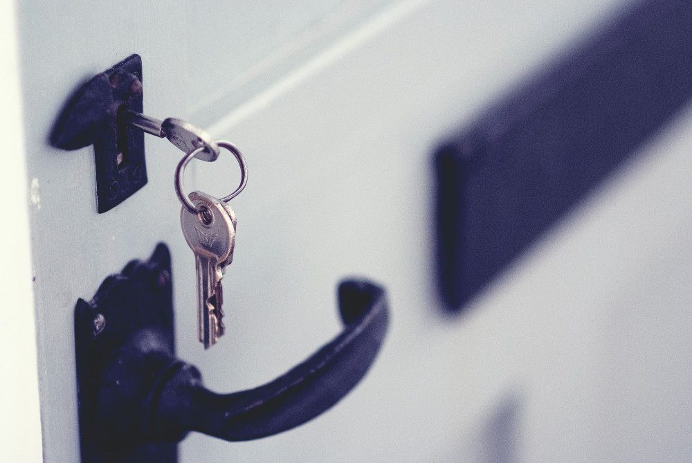 A photo of a set of keys in a door lock