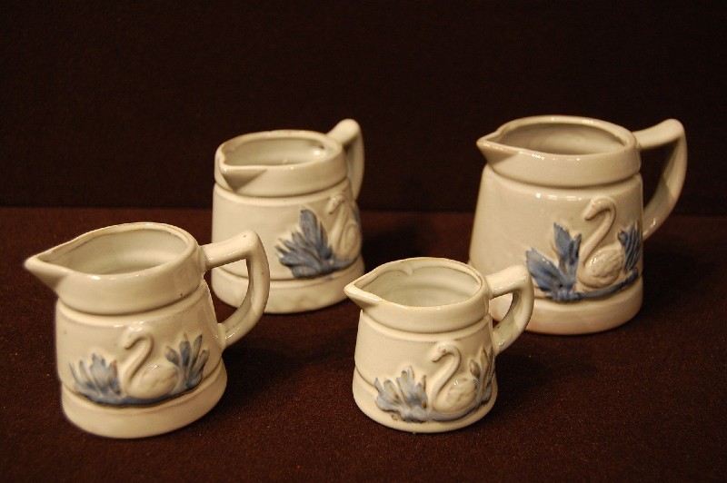 Photo of kitchen knick knacks - little jars with handles that are adorned with decoration.
