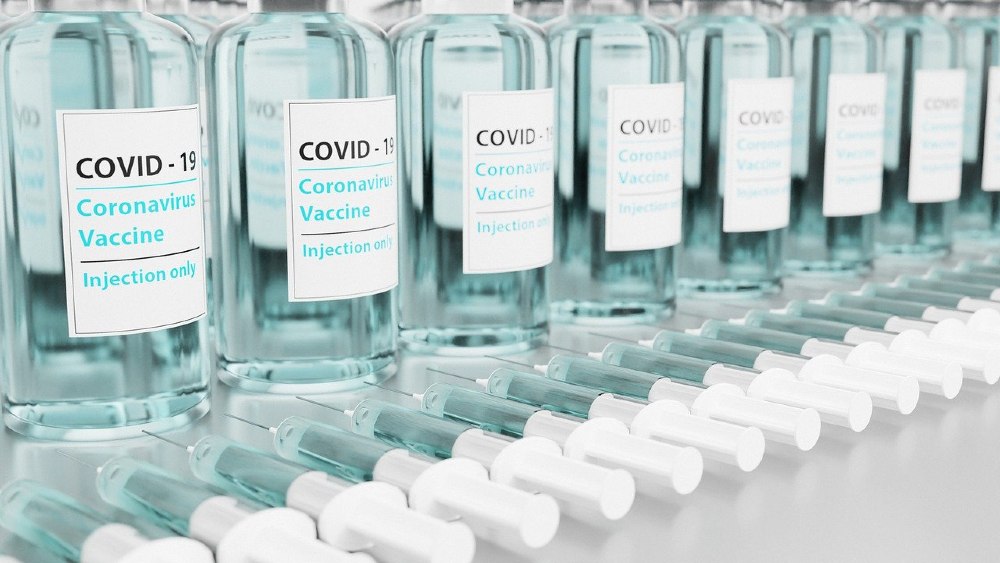 Photo of simulated COVID-19 vaccines with injection needles ready to vaccinate people.