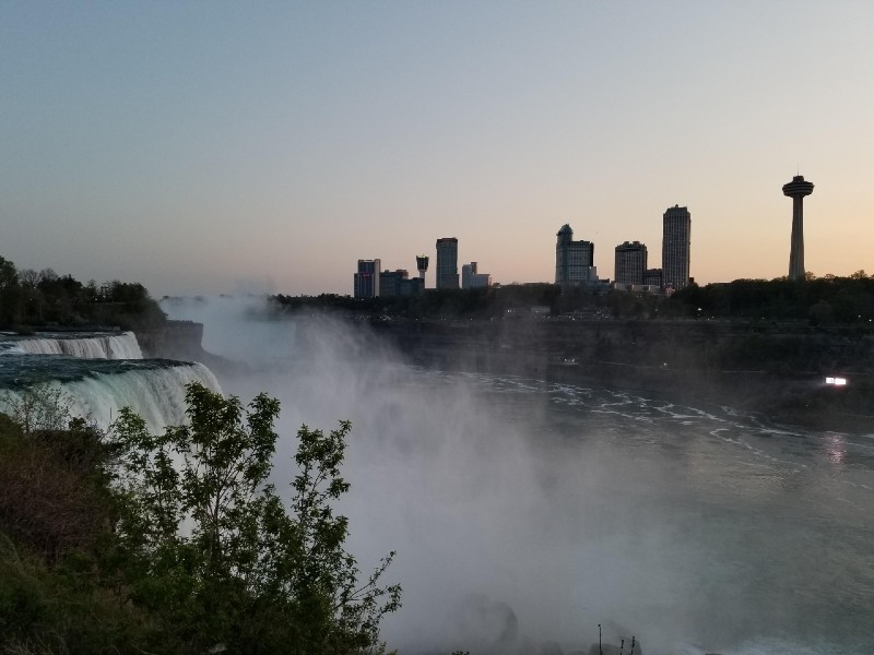 Mist rises from the falls in this daytime photo