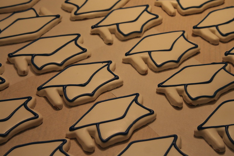 A photo of decorated cookies shaped like graduation hats