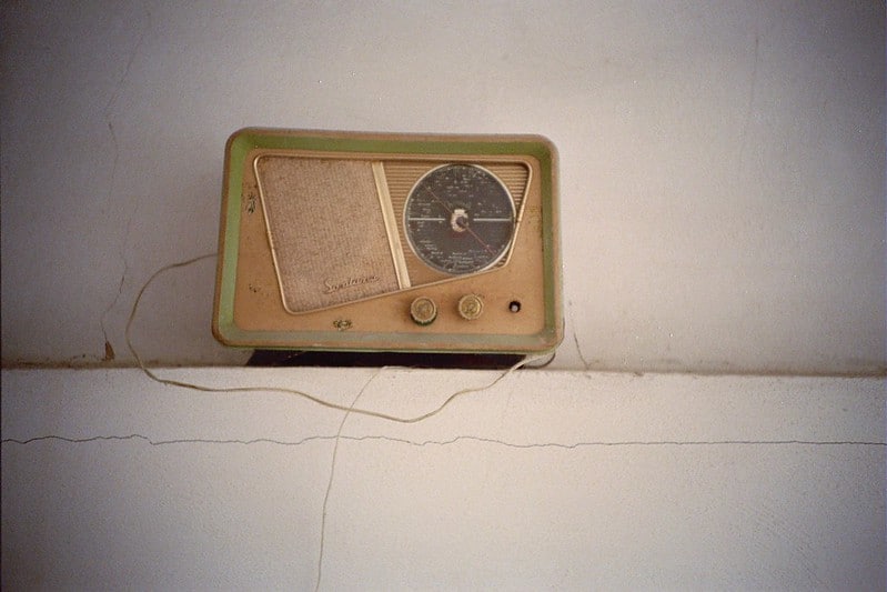 Photo of an old radio sitting on a shelf