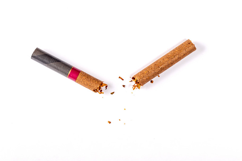 Photo of a cigarettes, without a paper wrapper, broken in half
