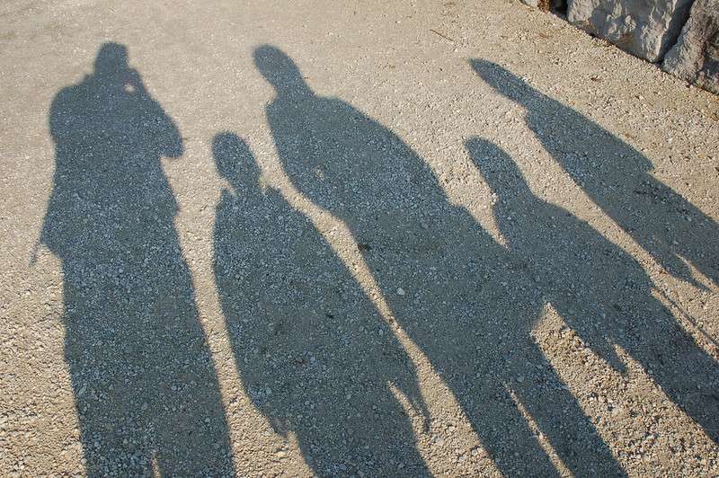 A photo of the shadows of a family of five