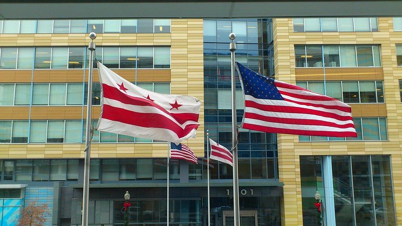 The DC and US flags fly in front of DCRA's offices