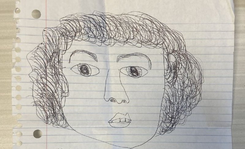 A photo of Patty's drawing of a self portrait with an ink pen