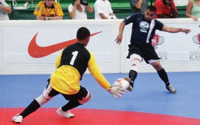 Photo of two players battling for the soccer ball