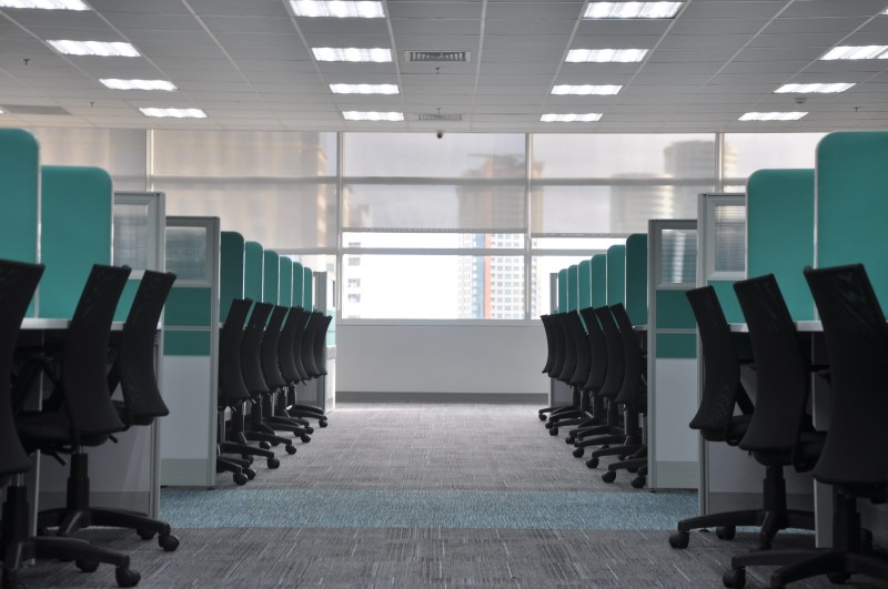 Photo of rows of vacant cubicles