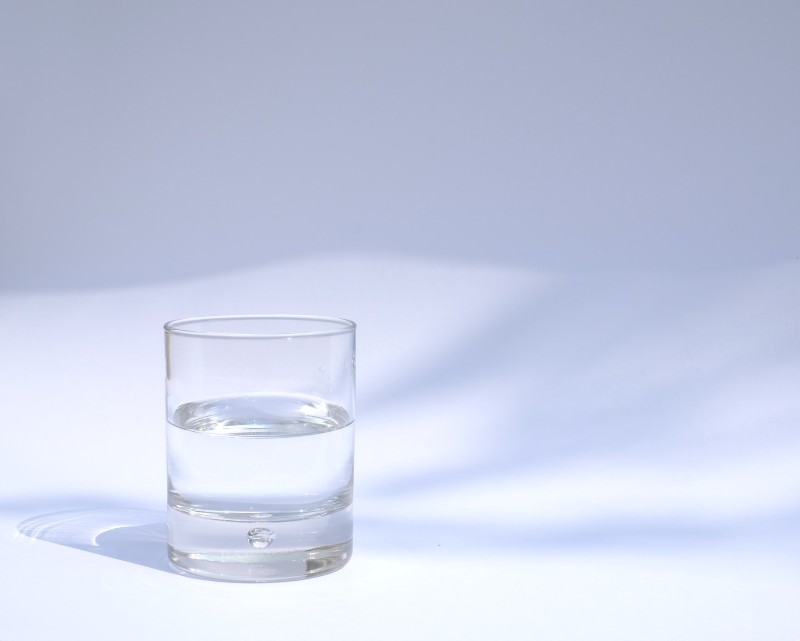 Photo of a glass of clear liquid.