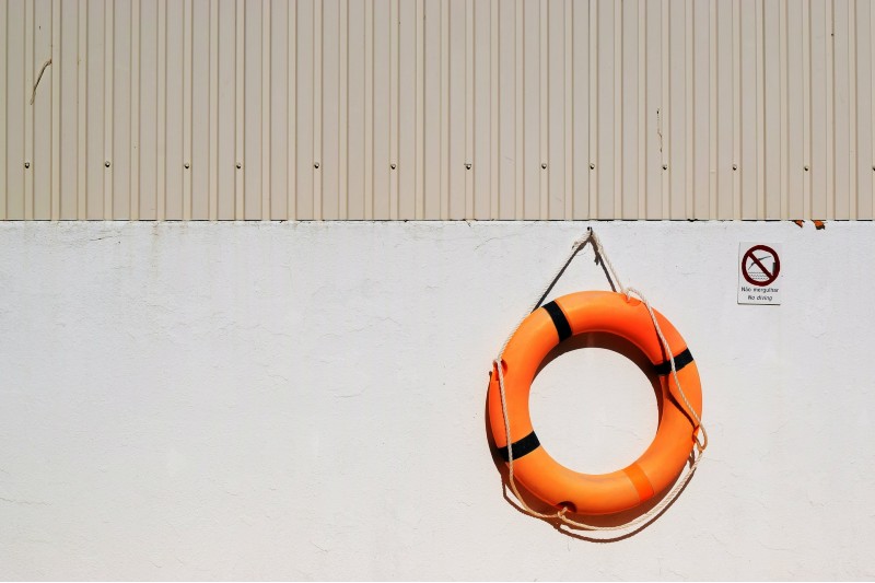 Photo of a life ring hanging on a wall