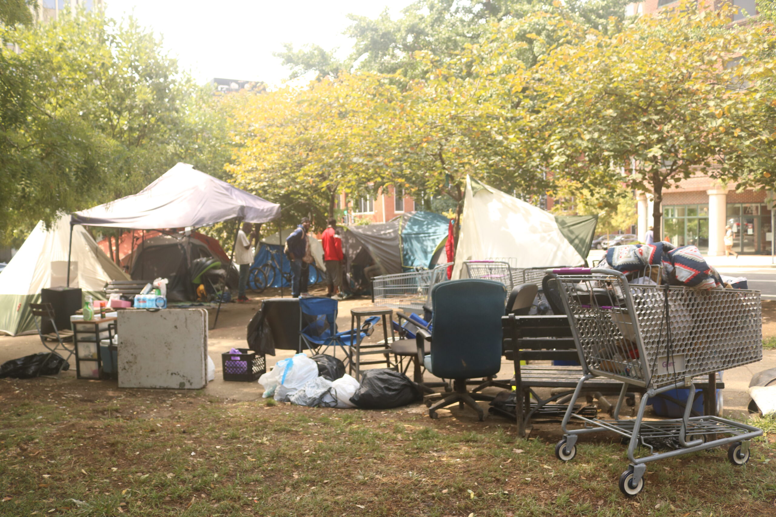 Photo of the community space set up by unsheltered residents at Burke and Gompers parks.