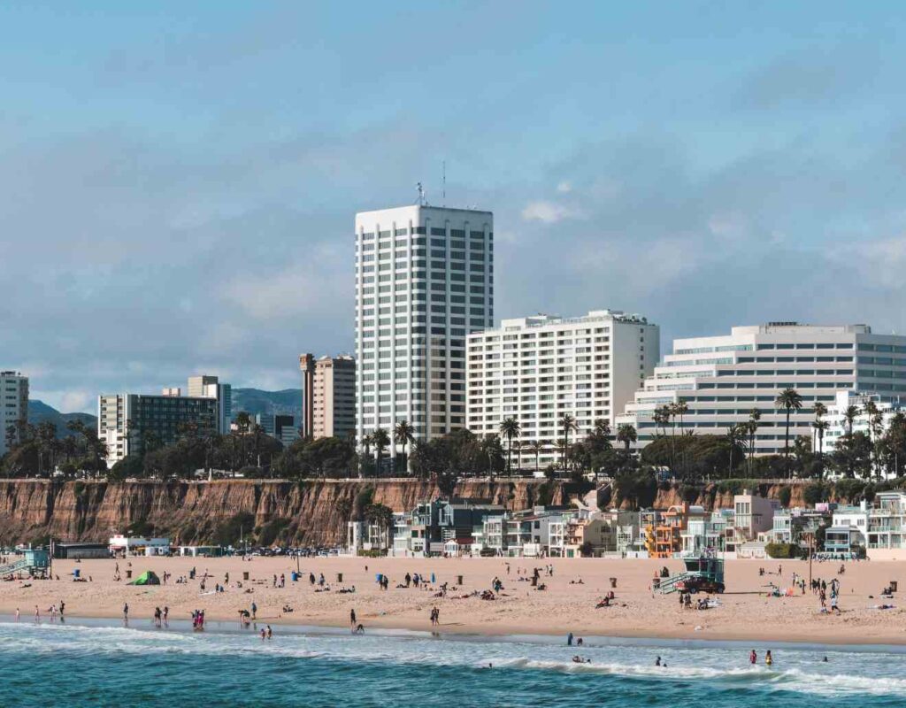 Photo of a Santa Monica beach with apartment housing in the background.