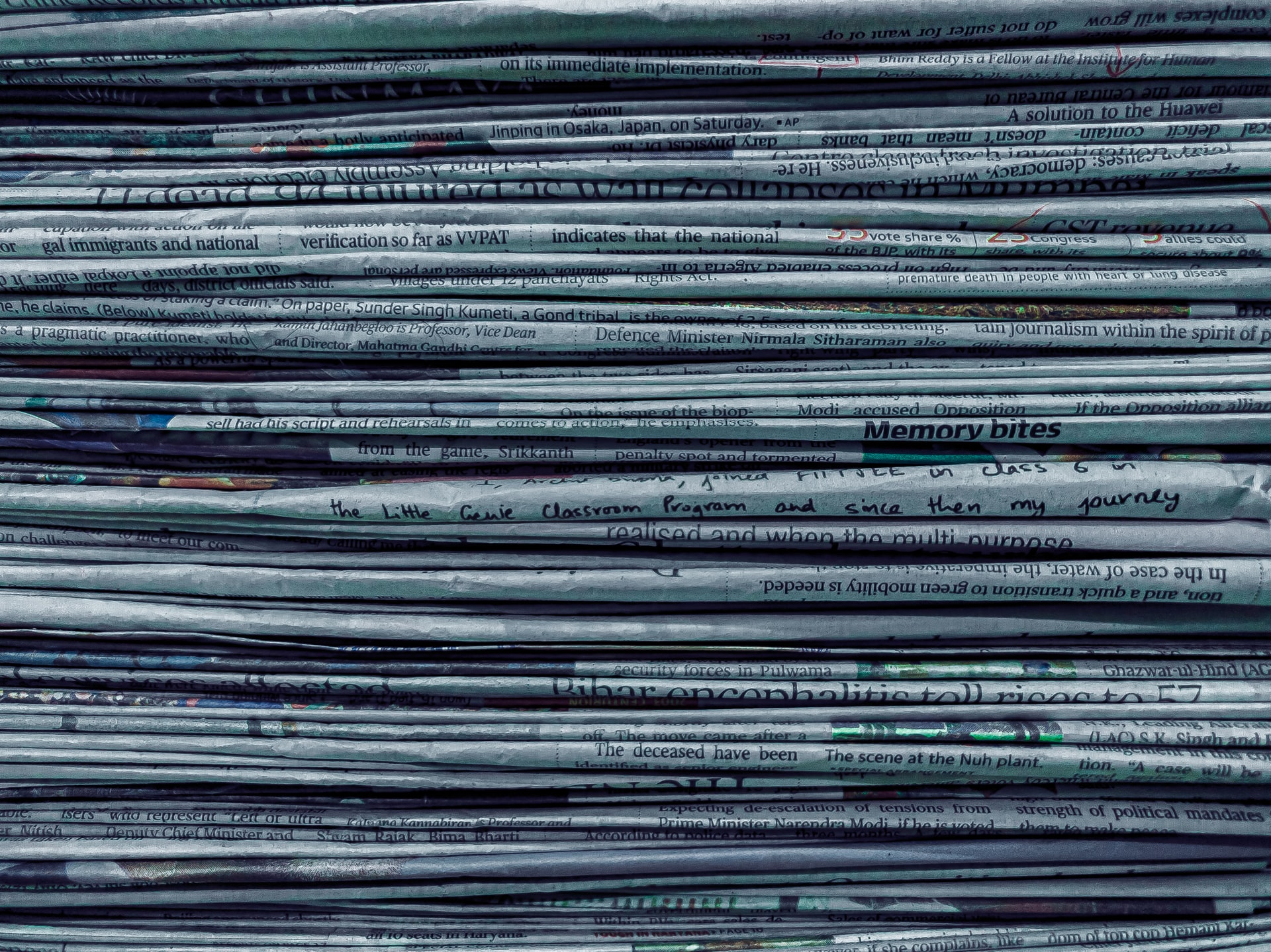 A photo of a pile of newspapers.