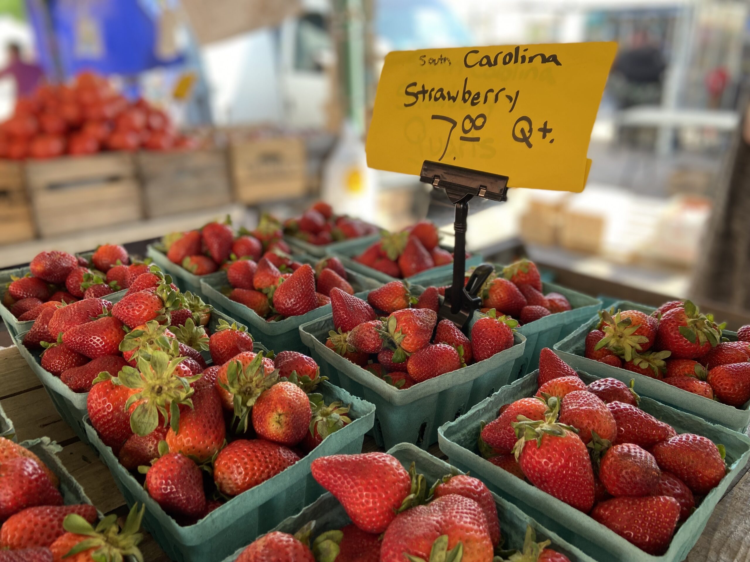 A box of strawberries on display at a farmers market near Capitol Hill. Photo by Will Schick.