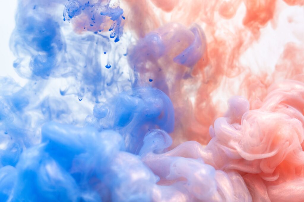 Images showing blue and orange bodies of smoke meeting each other